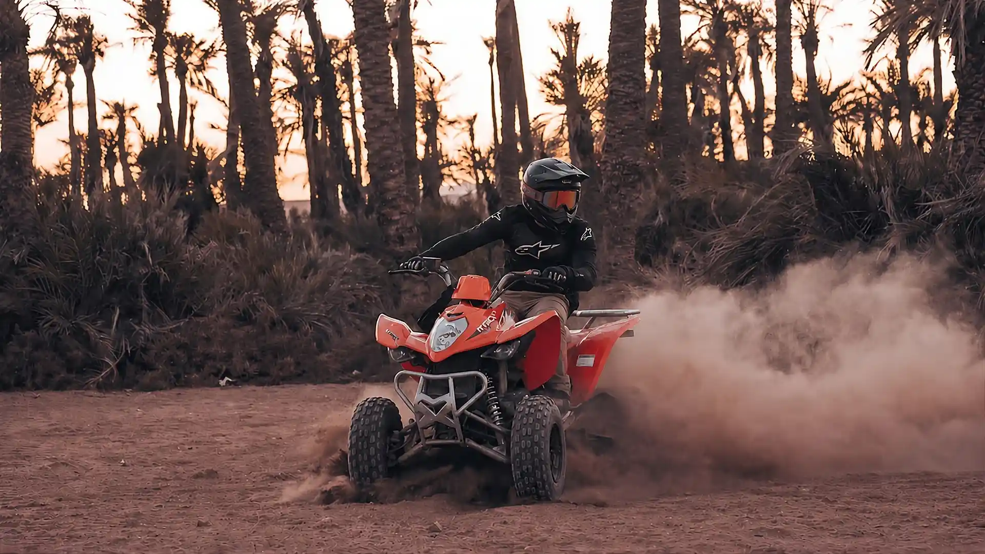 Quad bikes riding through Marrakech Palmeraie desert landscape